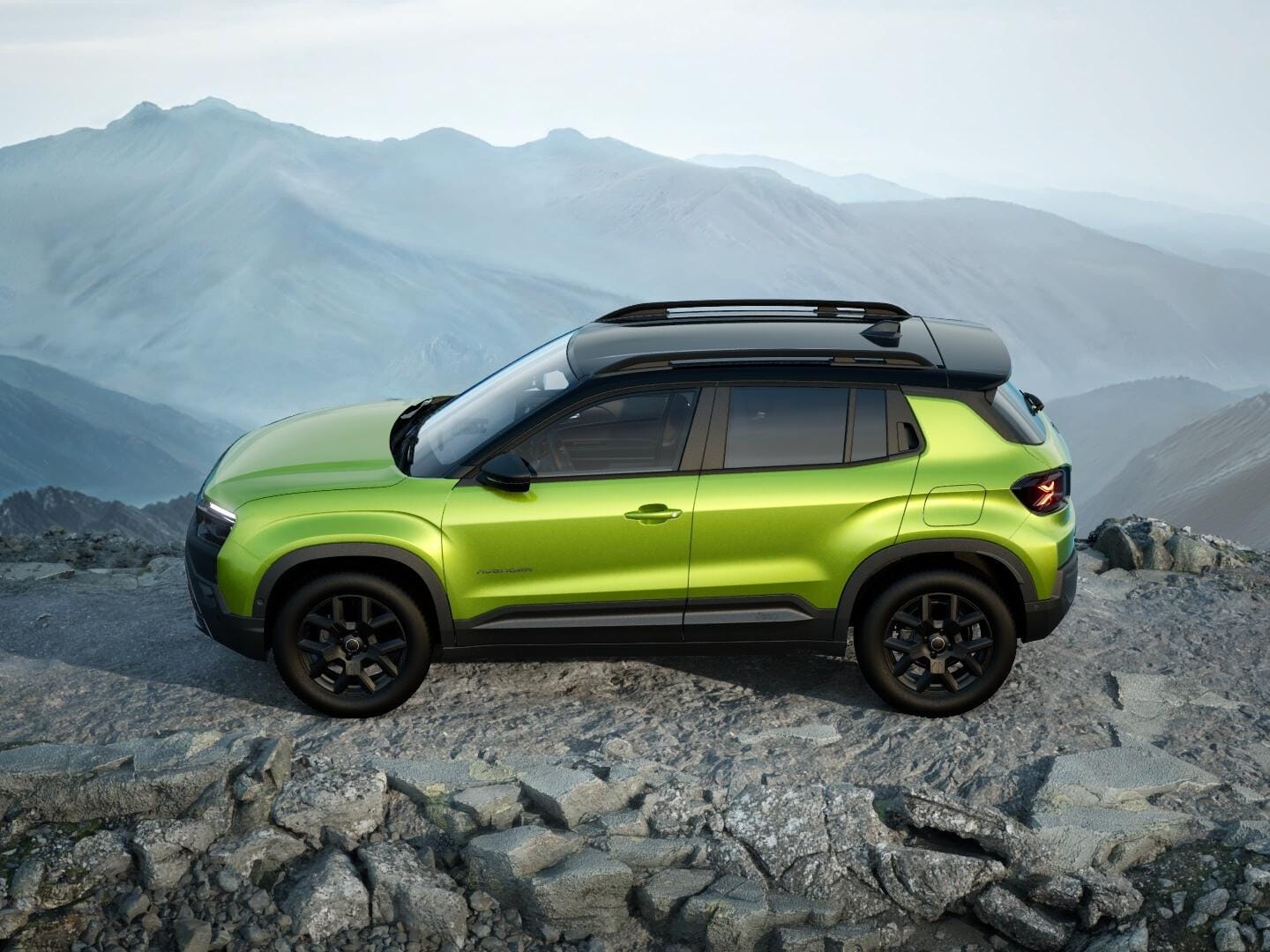 Grüner Jeep Avenger 4xe Upland mit schwarzem Dach in Seitenansicht auf felsigem Gelände.