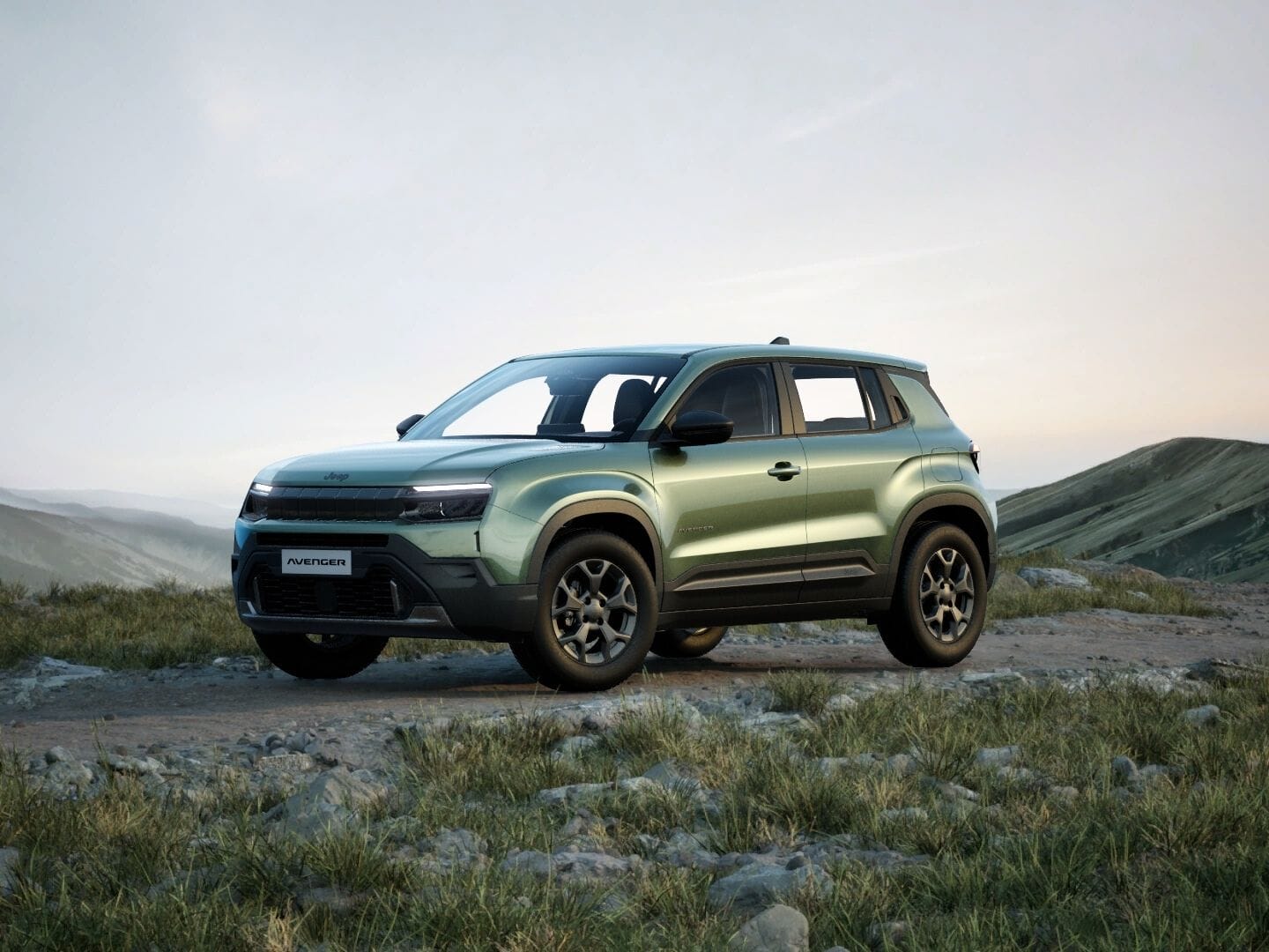 Grüner Jeep Avenger Longitude in Frontansicht vor einer weitläufigen Berglandschaft.