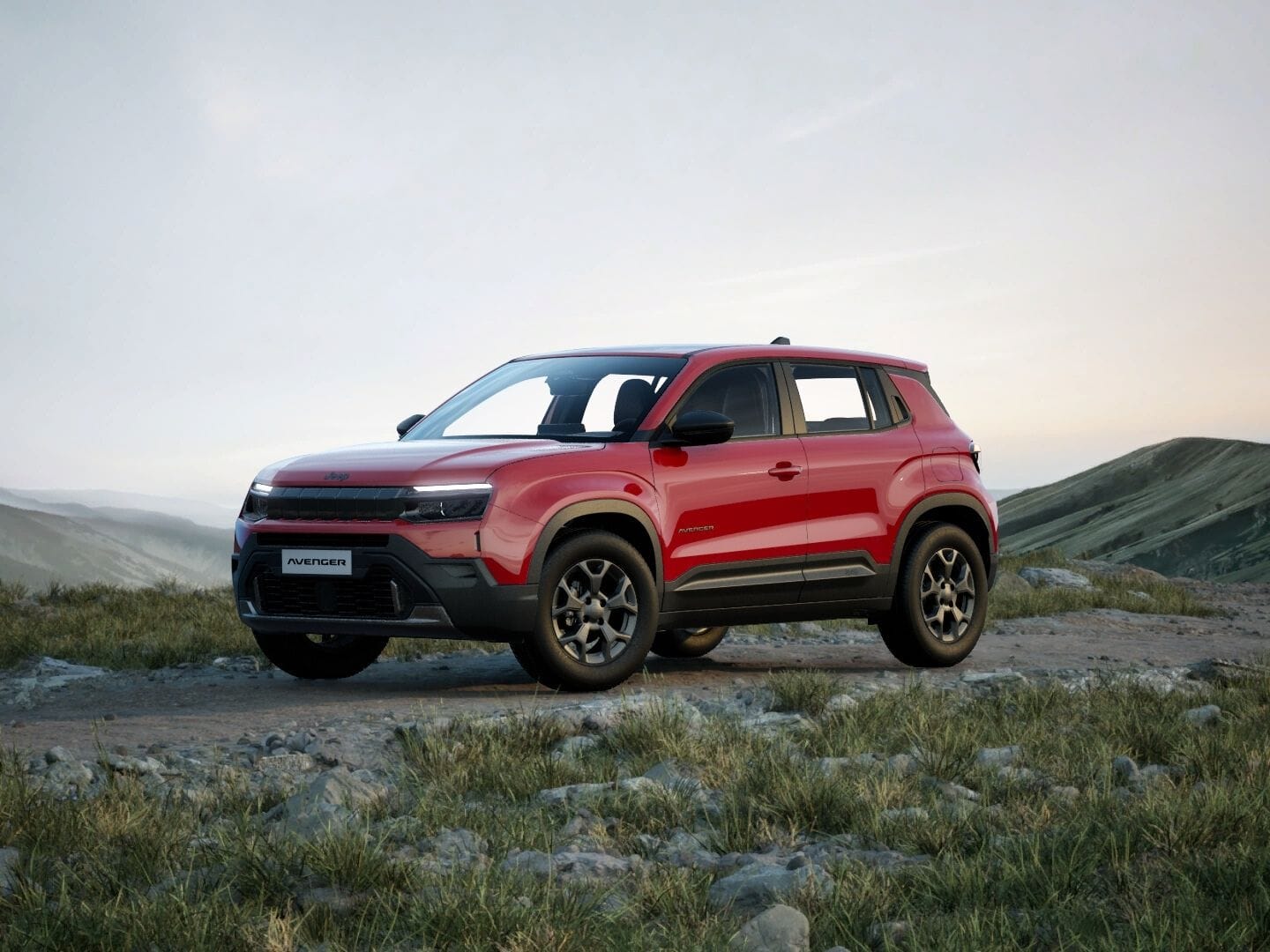 Roter Jeep Avenger Longitude in Frontansicht vor einer weitläufigen Berglandschaft.